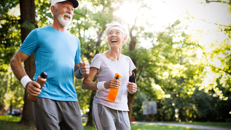 senior couple running outside to prevent osteoarthritis