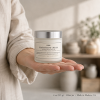 Magnesium Cream 4 oz glass jar held in an open palm to show its size