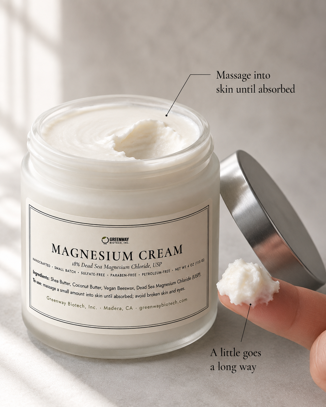 Close-up of Magnesium Cream's rich buttery texture with a small amount on a fingertip